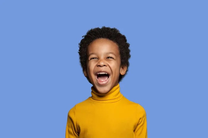 Happy child on a blue background