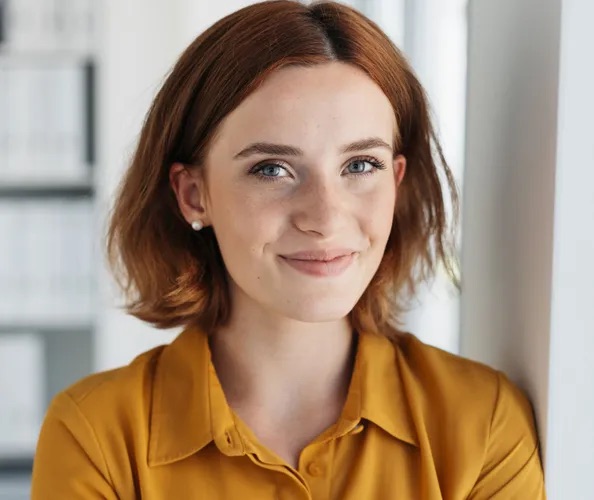 Smiling woman in a yellow top