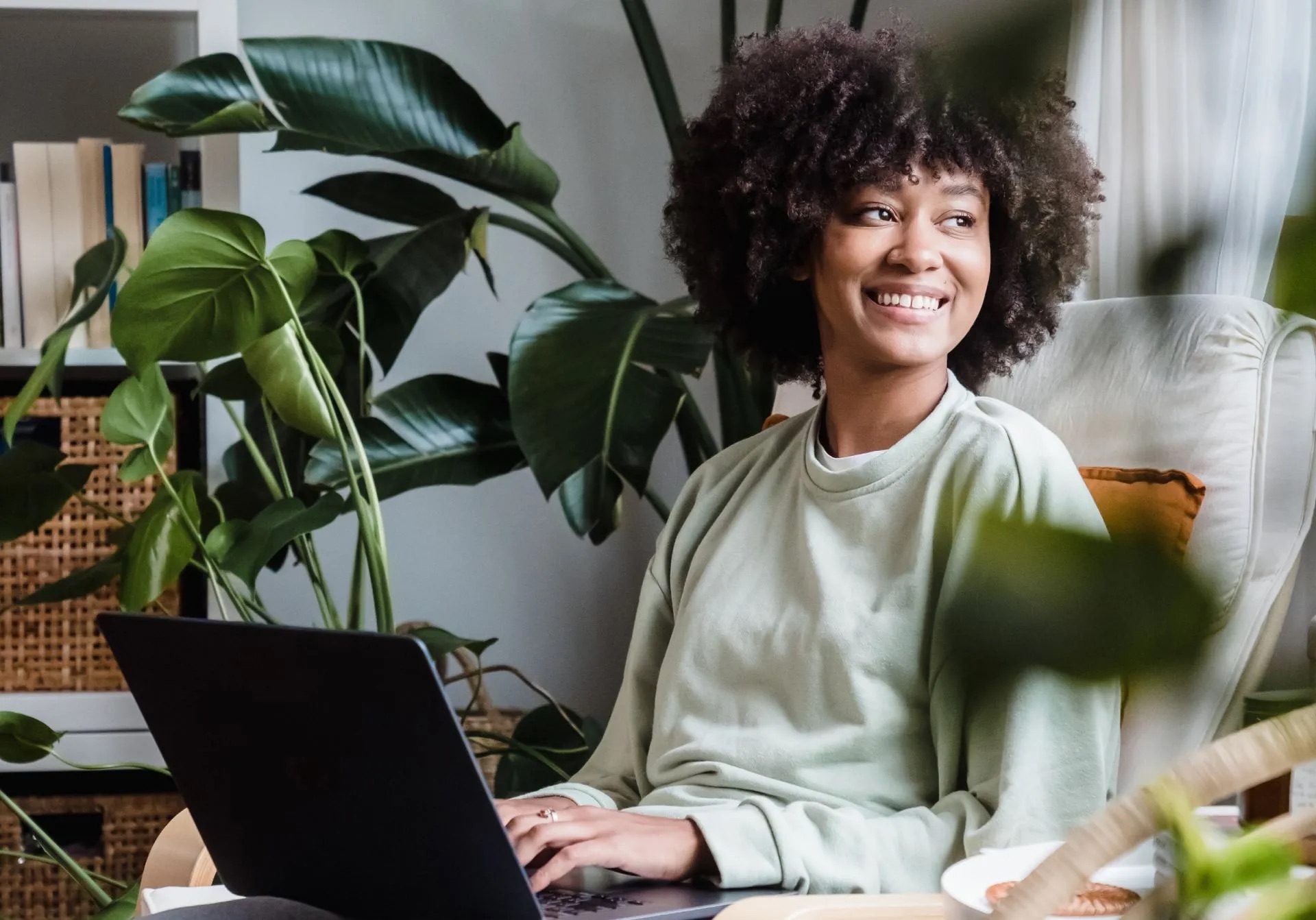 Smiling woman working on a laptop