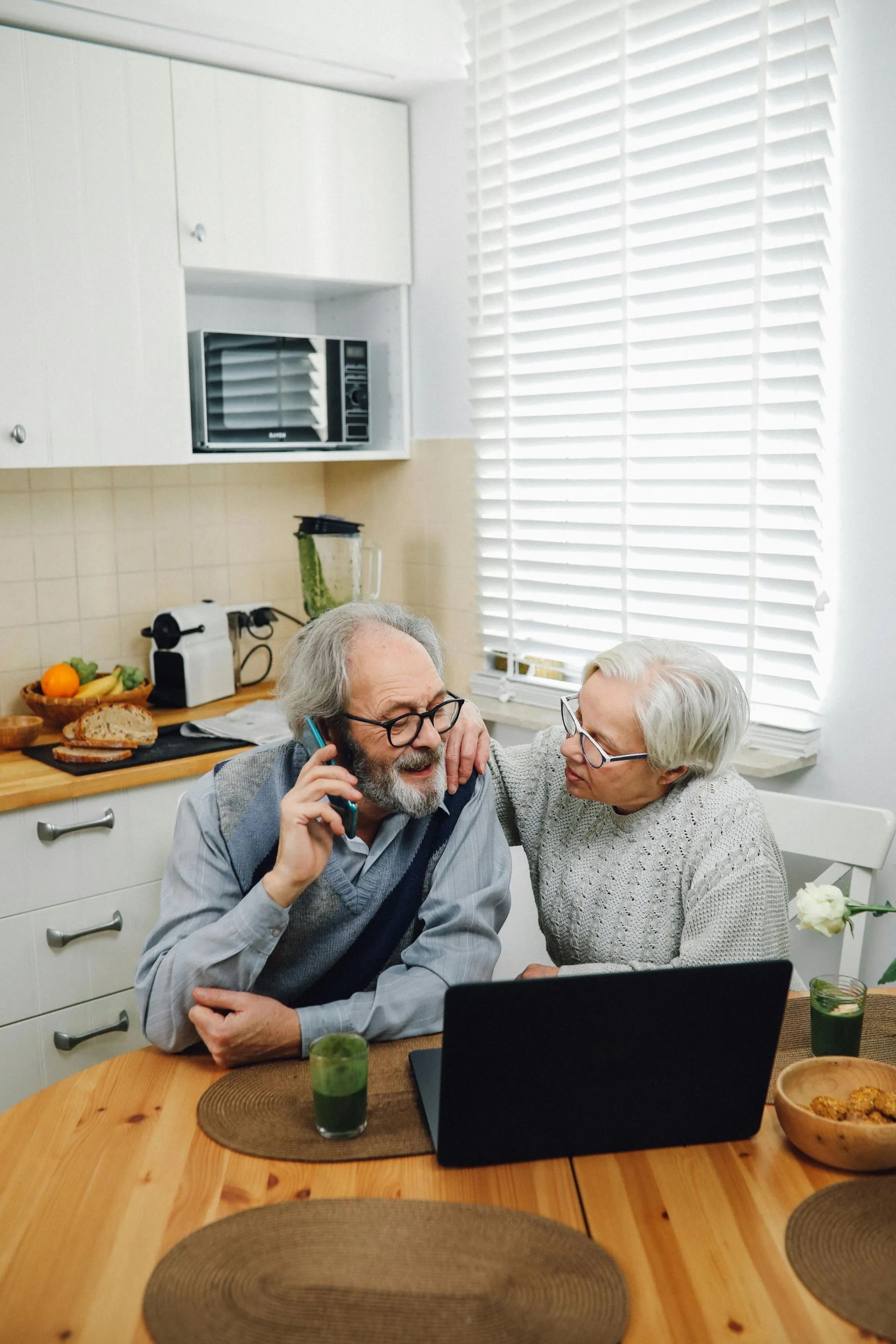 Older couple on a call in their kitchen