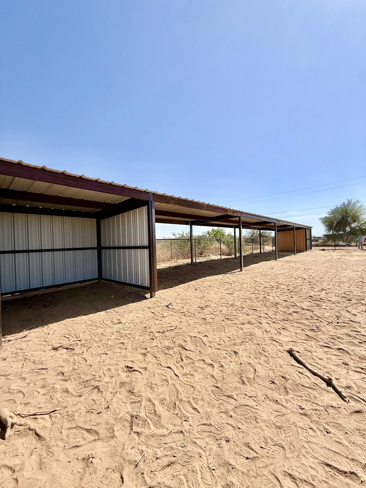 Row of steel horse shelters by Stein Steel