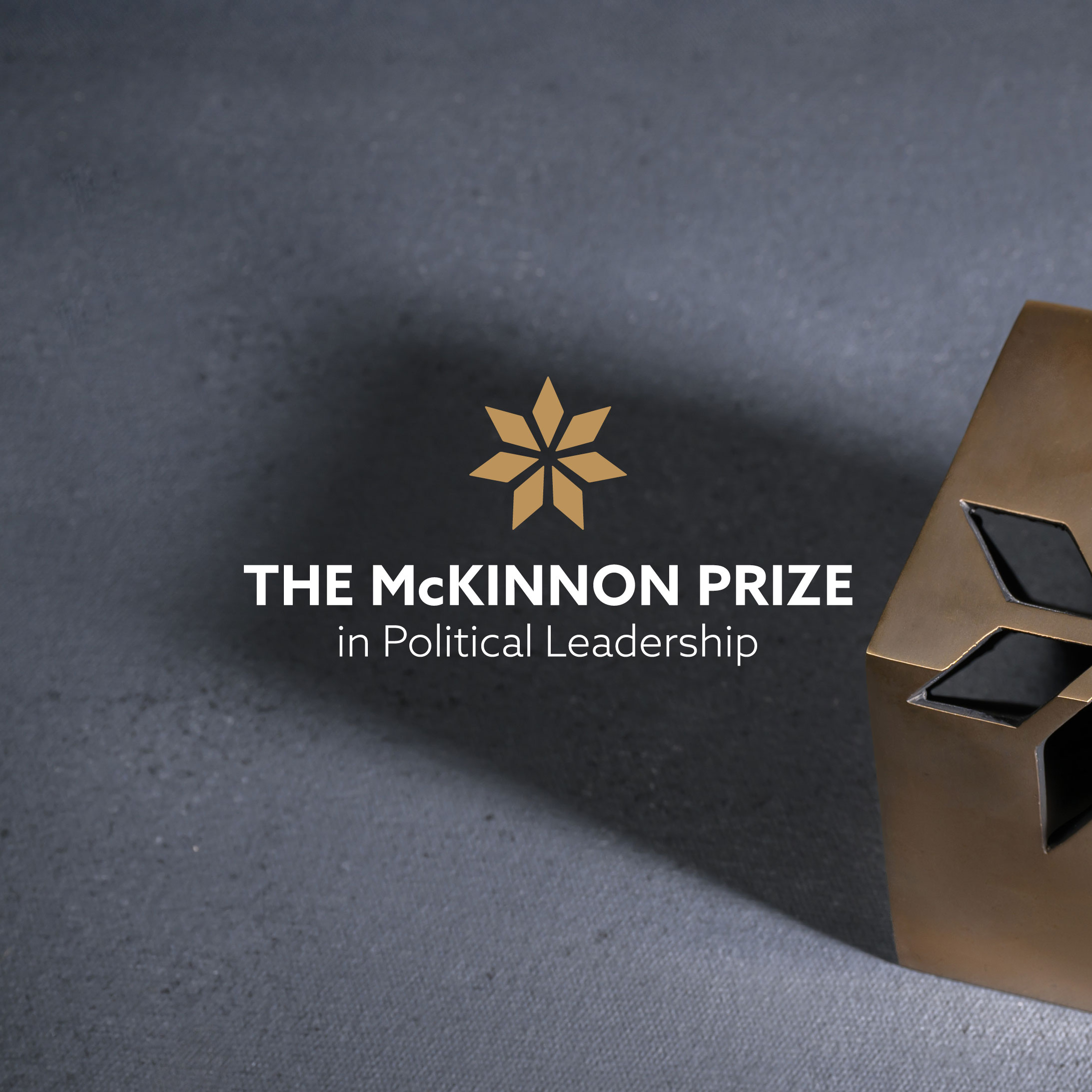 The McKinnon Prize logo with a background of the McKinnon Prize award 
