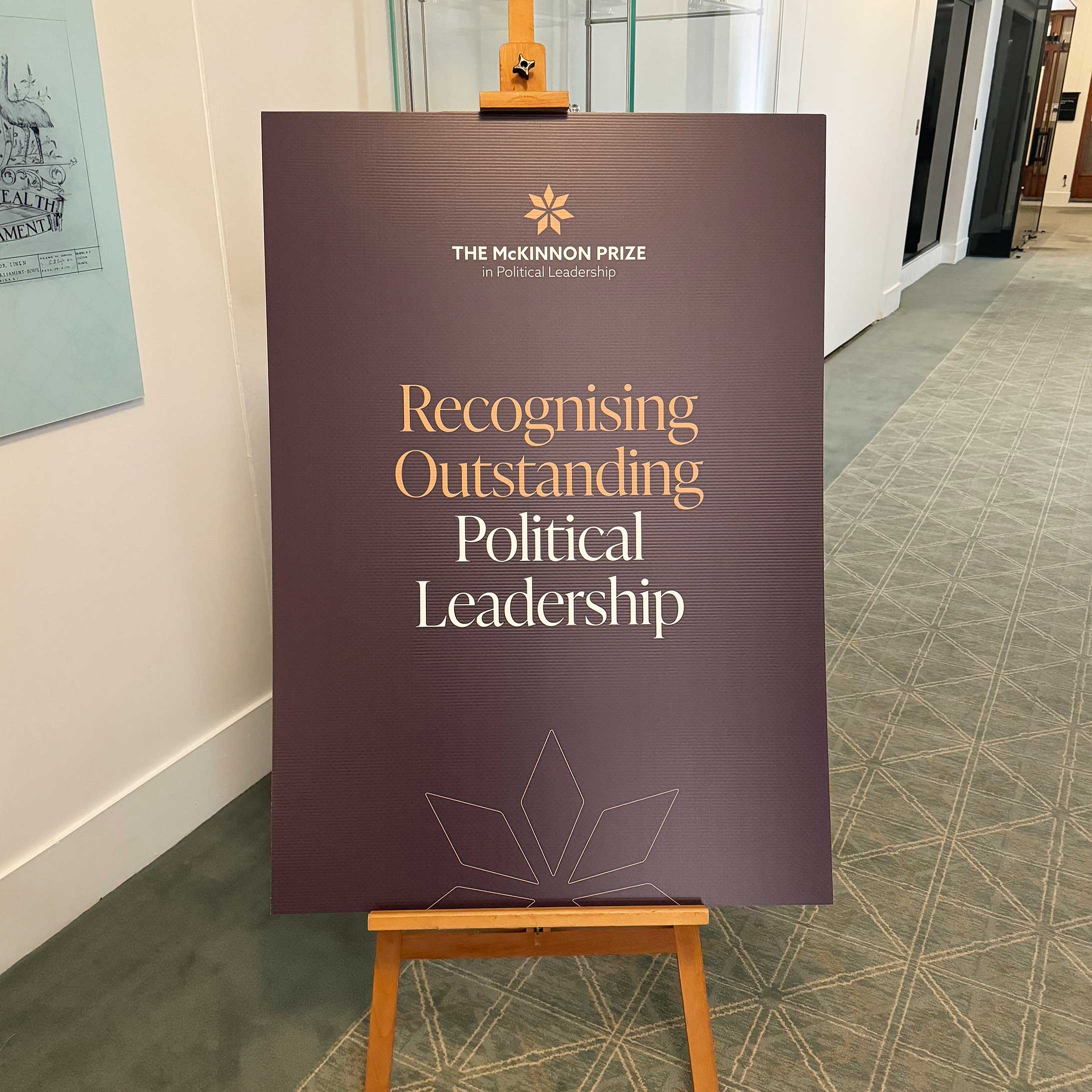 Visual branding for the McKinnon Prize in Political Leadership. A1 corflute on an easel in Old Parliament House, Canberra.