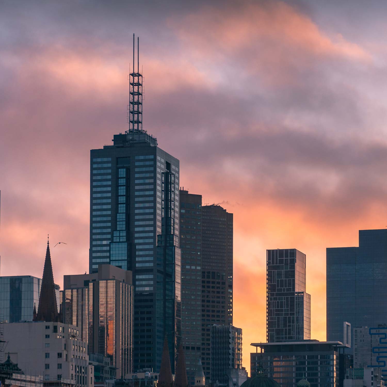 Sunrise in Melbourne with 101 Collins Street building as the central focus.