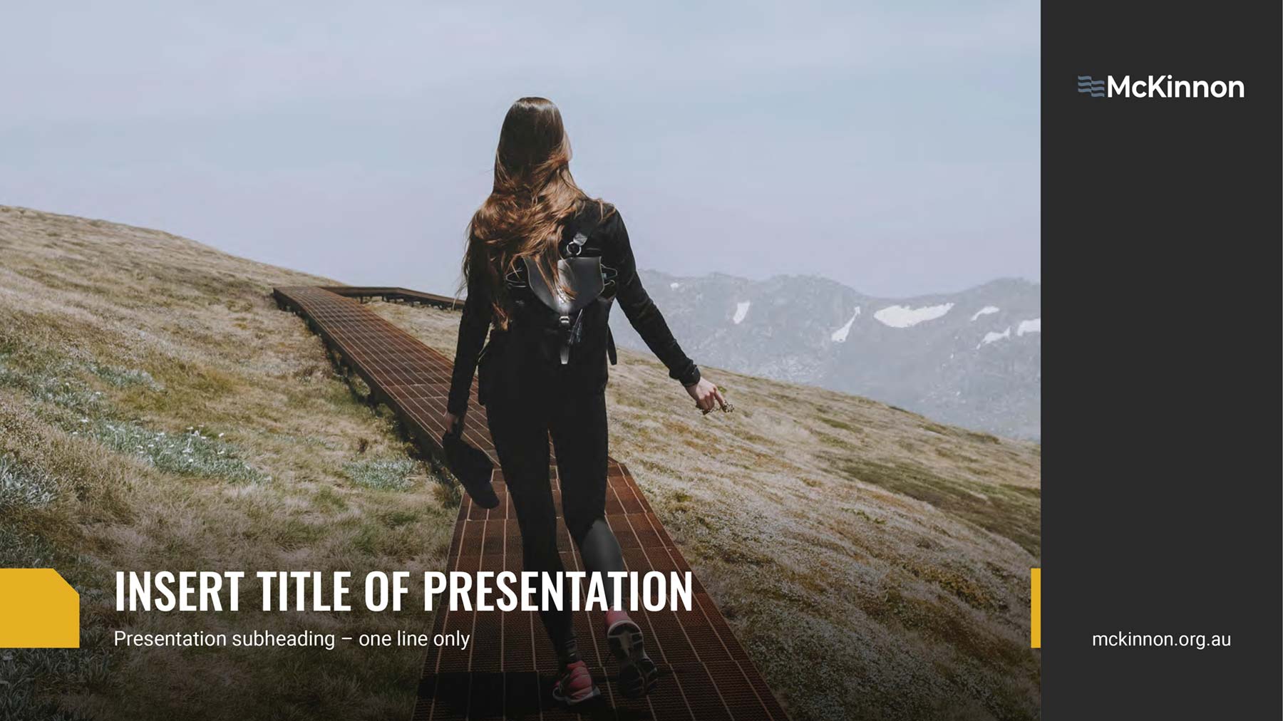 McKinnon widescreen PowerPoint template - cover page with image of lady climbing in the mountains.