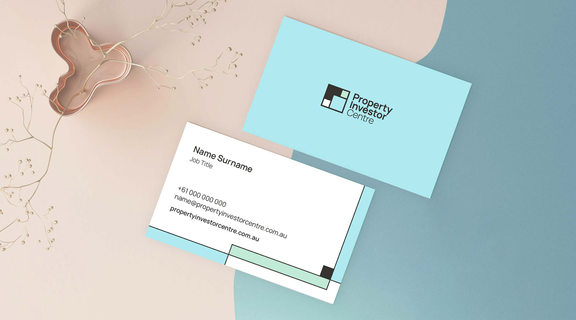 Property Investor Centre business cards on pink and blue background