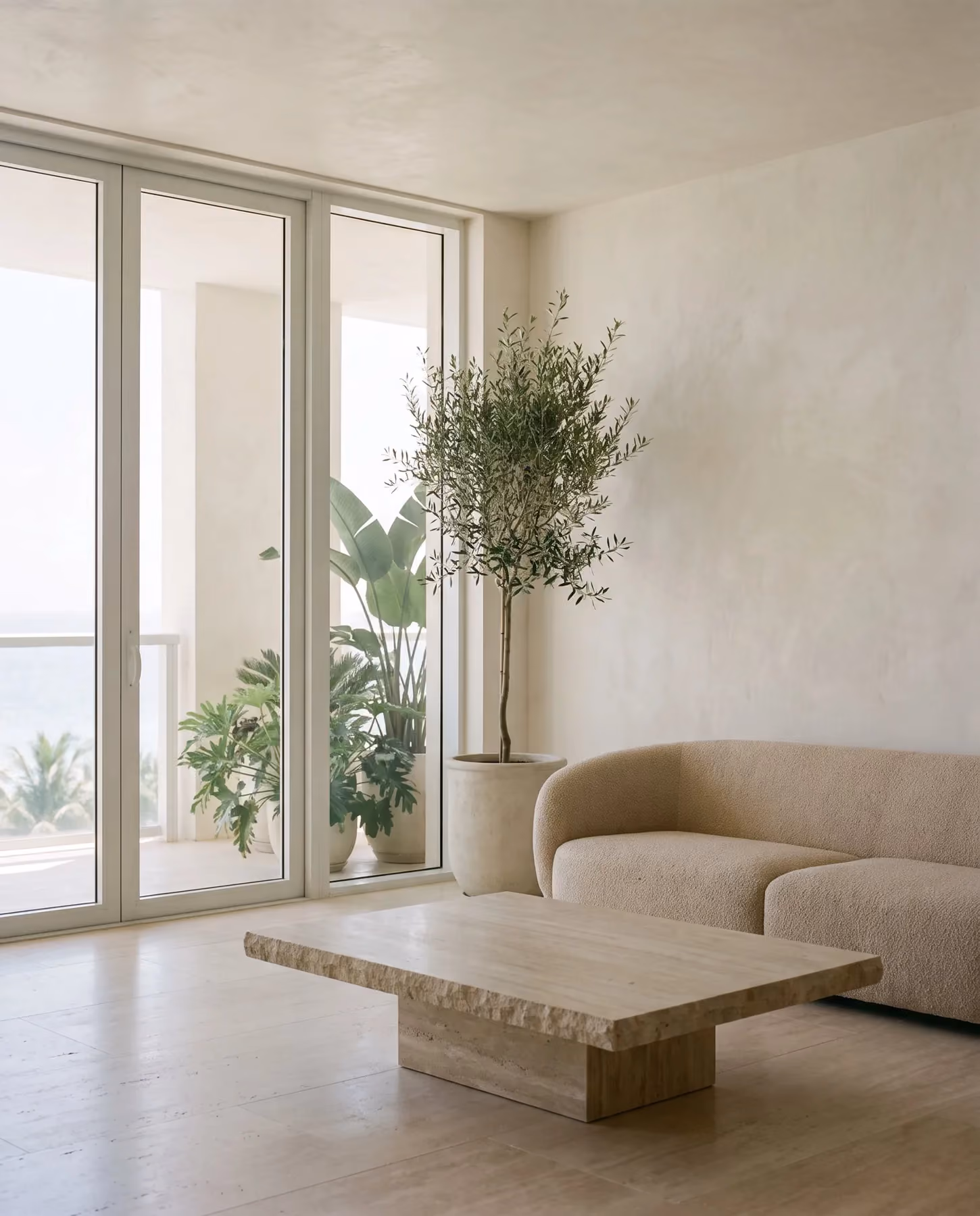 Living room of the two-bedroom corner residence opening to the loggia
