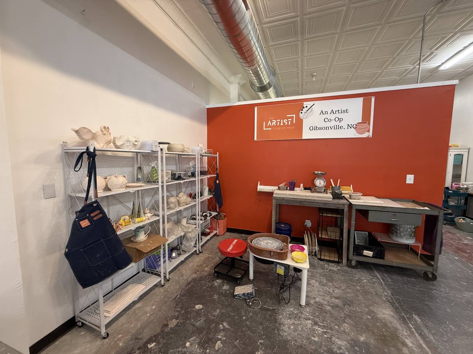 Workspace and pottery equipment inside The Artist Coop