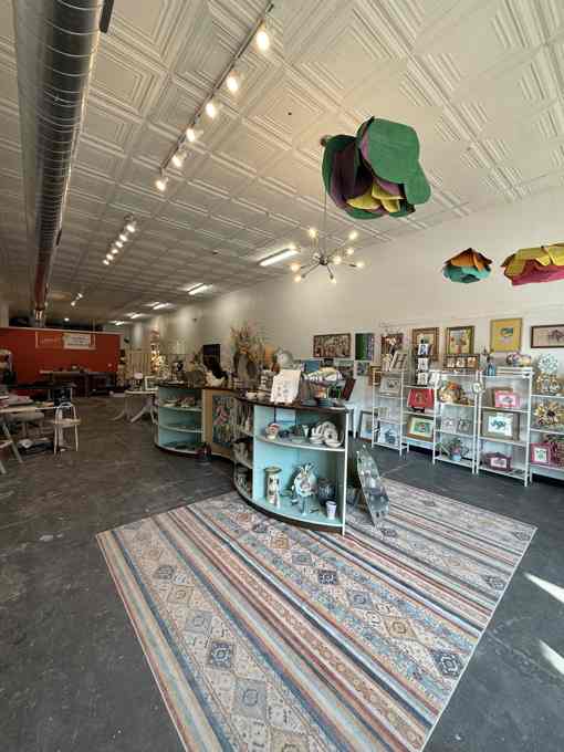 Interior of The Artist Coop gallery with shared displays and work by multiple artists