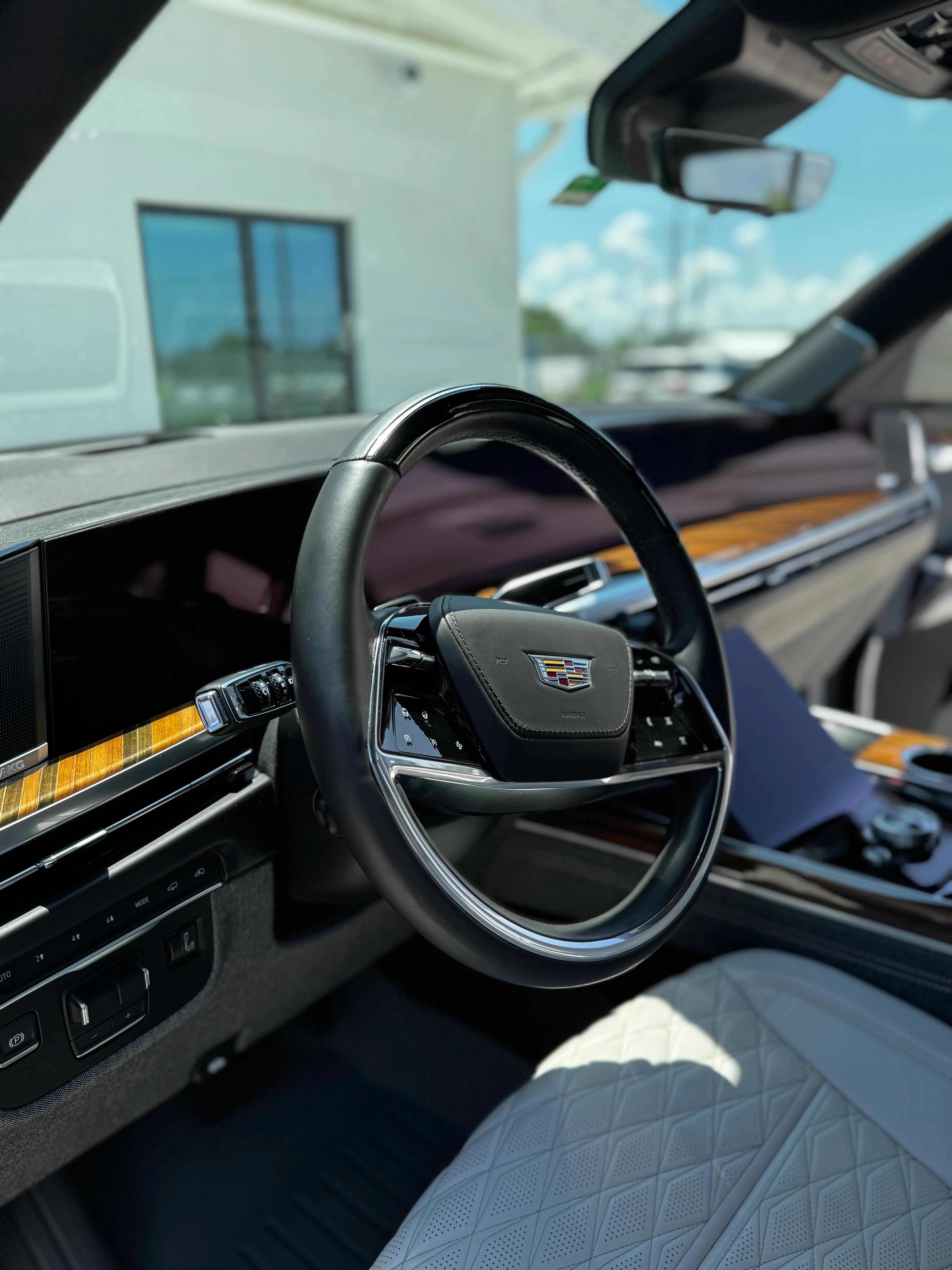Clean steering wheel, dash and quilted leather seats after an interior detail