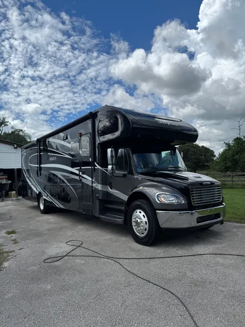 Black motorhome after an exterior detail