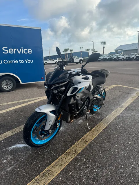 Freshly cleaned sport motorcycle with blue wheels