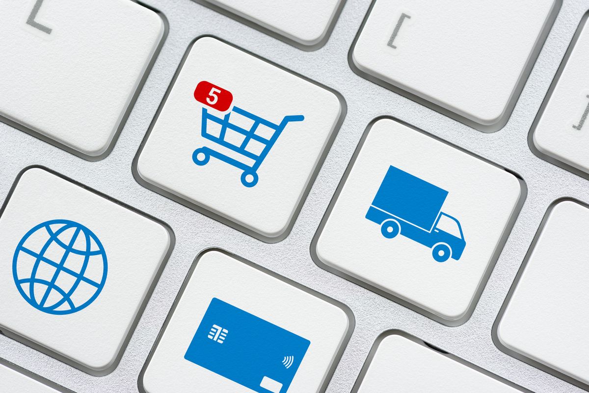 Keyboard keys marked with a shopping trolley, a delivery lorry, a globe and a payment card