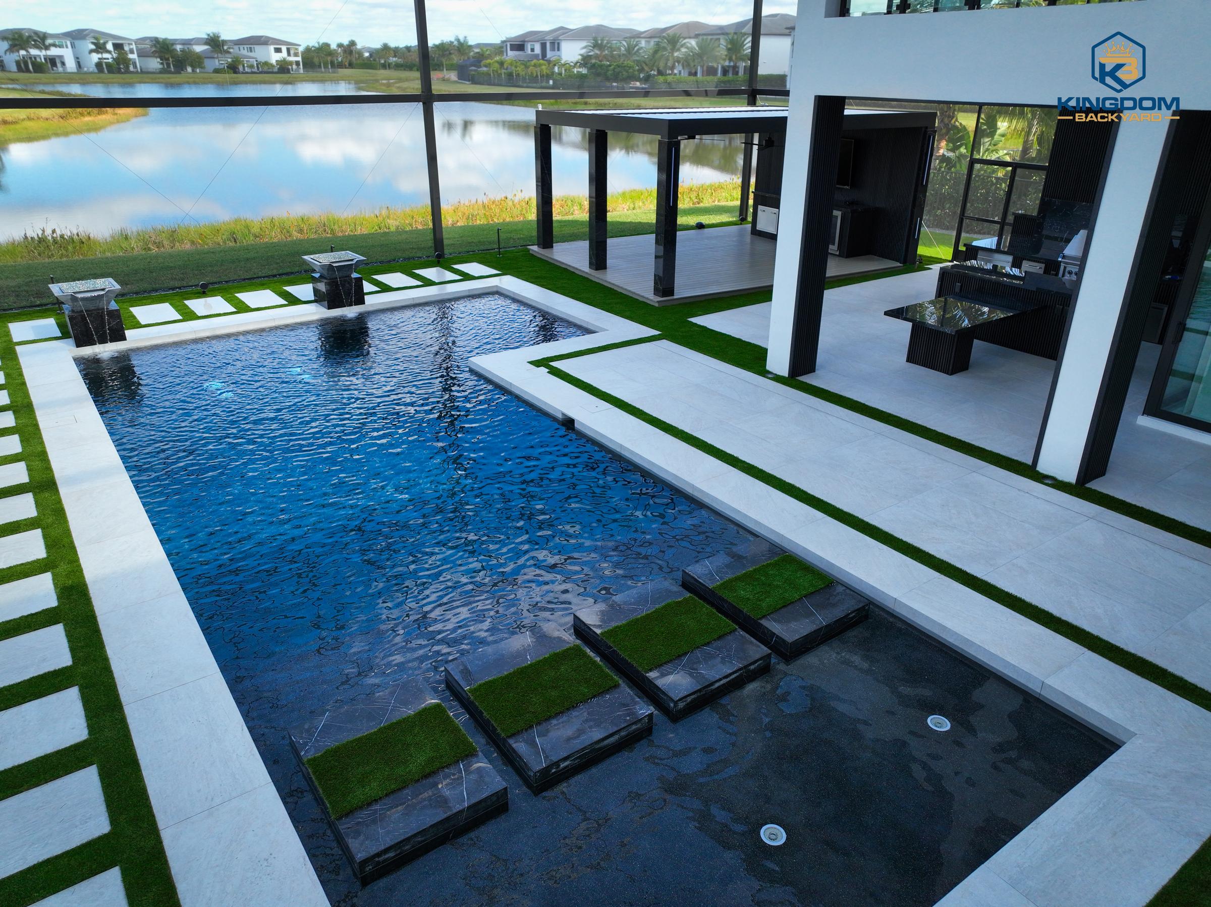 Porcelain pool deck with floating step pads into a raised spa