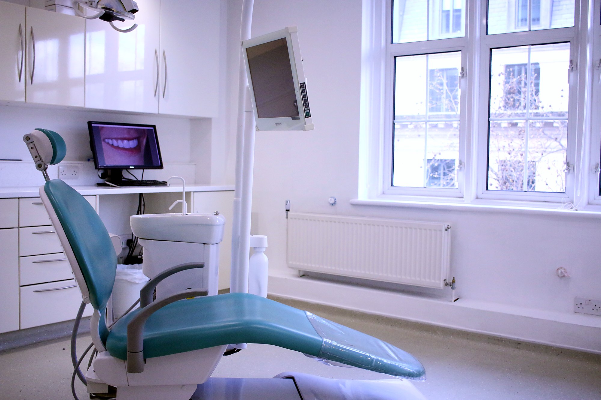 A surgery at Sardinia House with its chair and screen