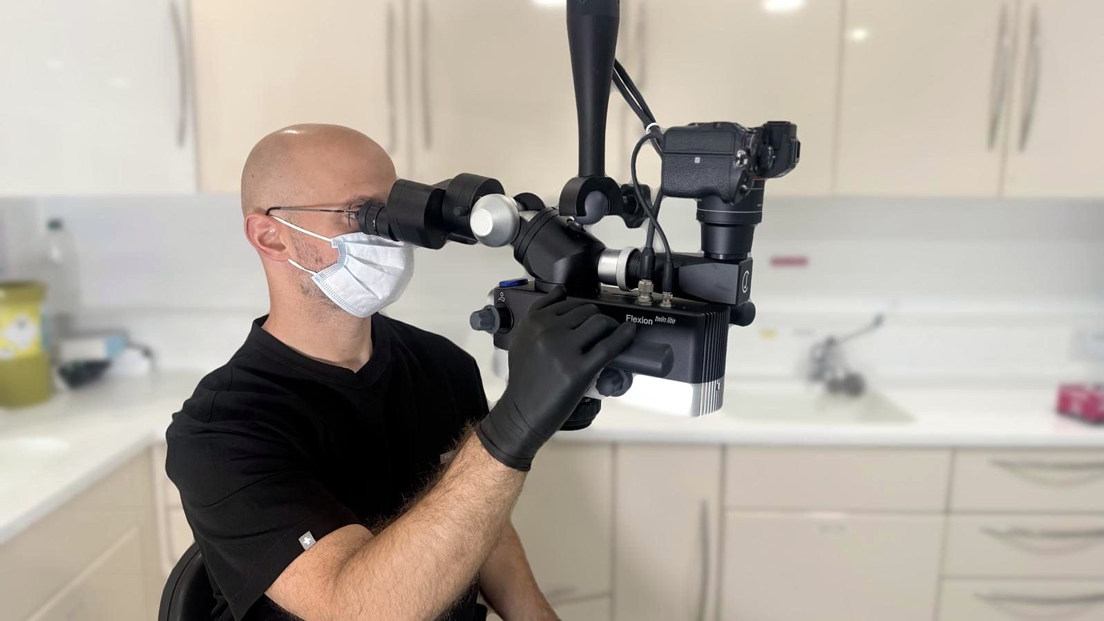 Dr Spencer Richman working under the operating microscope
