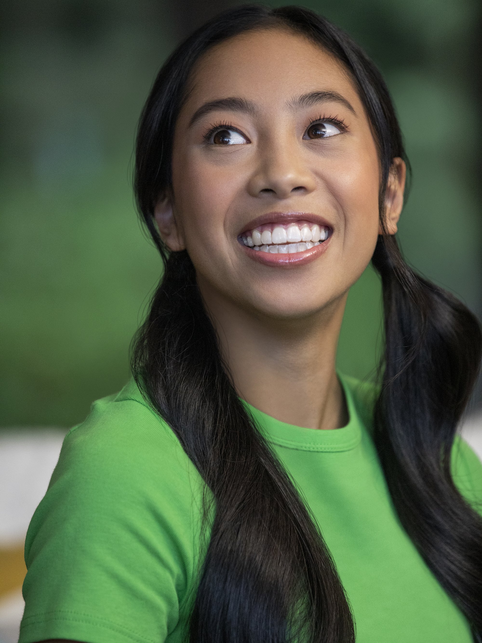 A woman smiling with Invisalign clear aligners