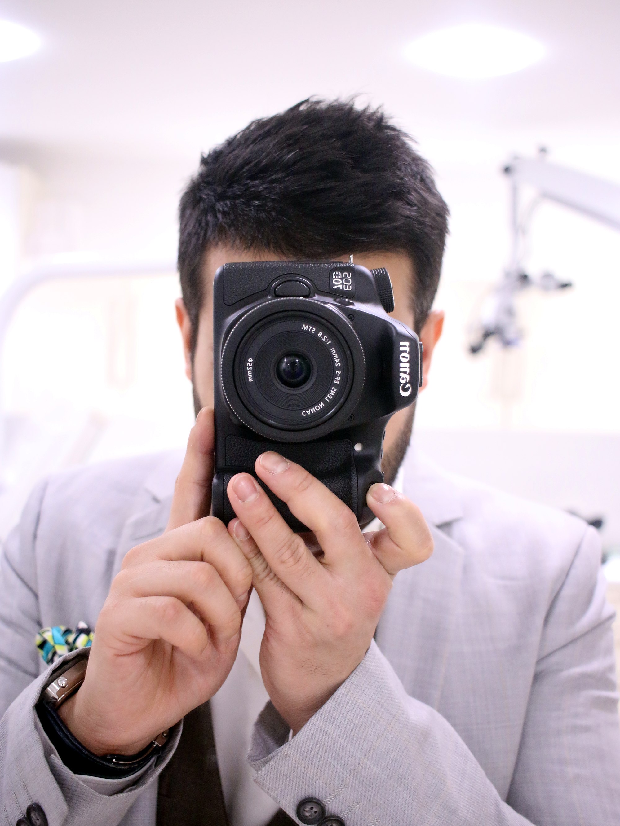 Dr Amit Patel with the camera used for smile design