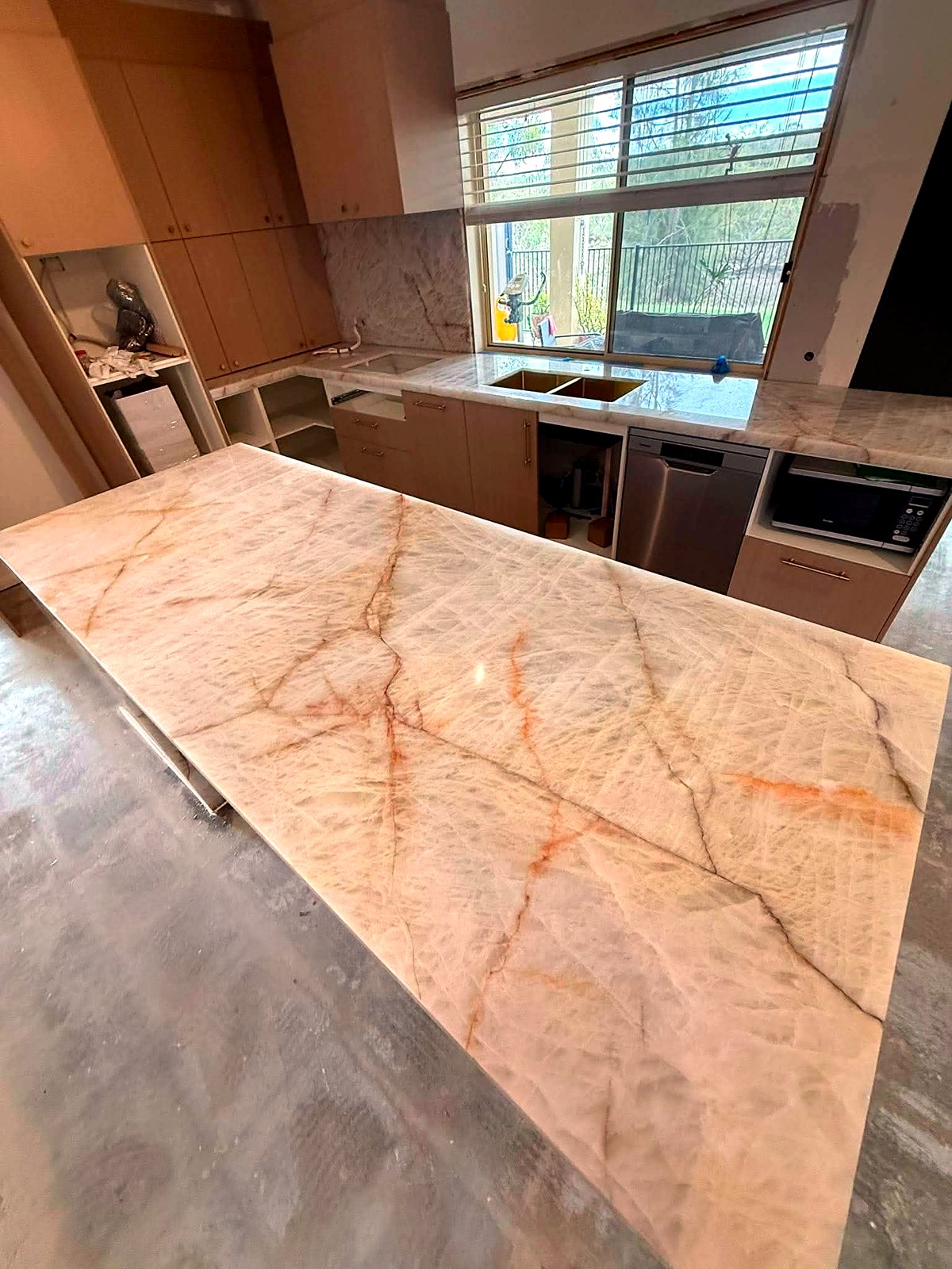 Cristallo quartzite kitchen island during installation