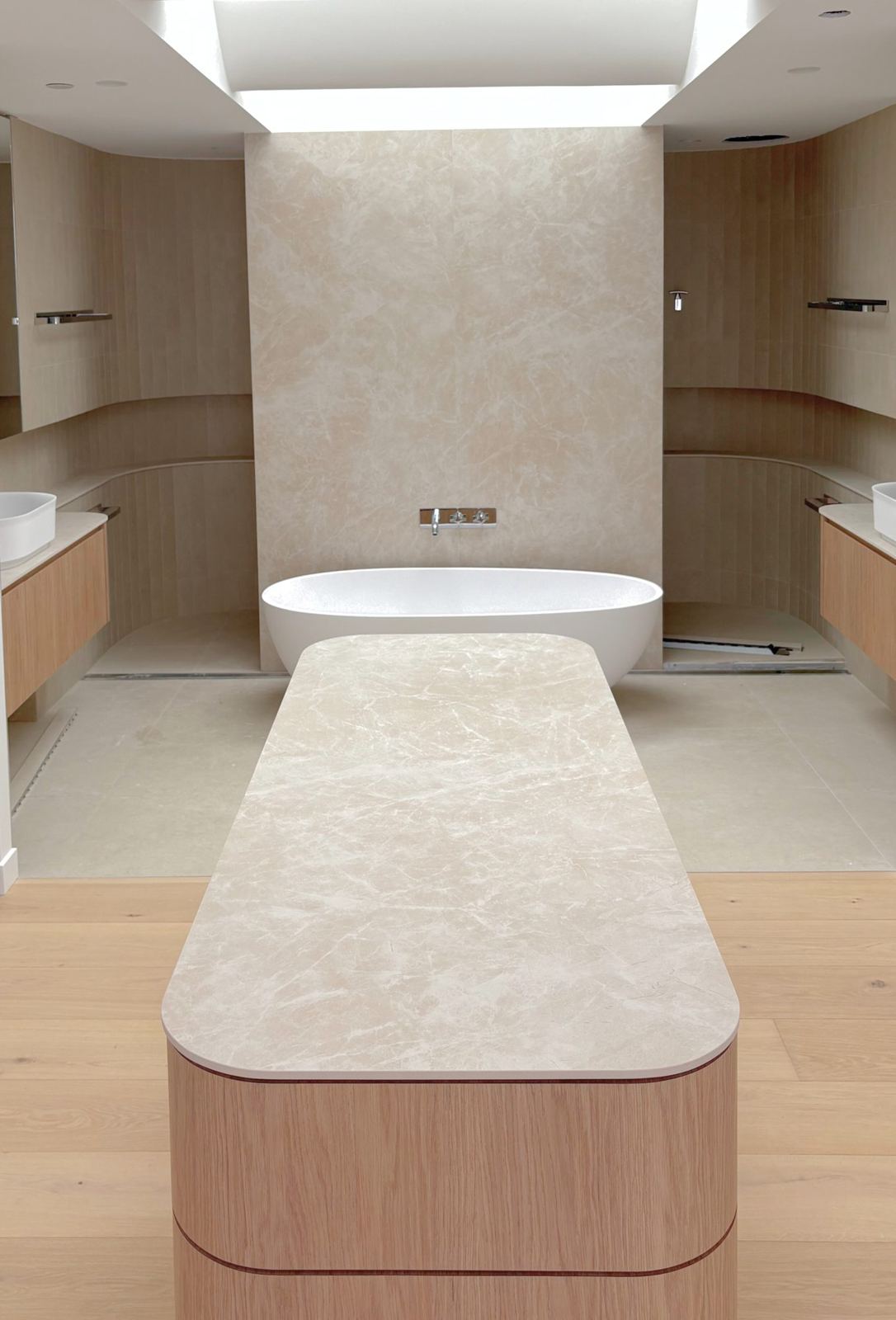 Bathroom with stone feature wall and freestanding bath