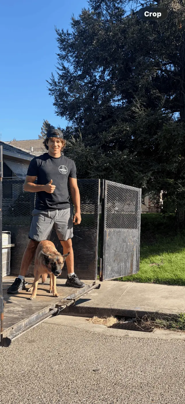 Jake standing on the trailer ramp with his dog