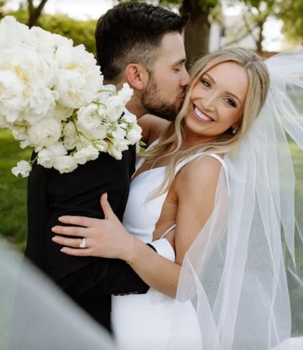 Bride smiling under her veil