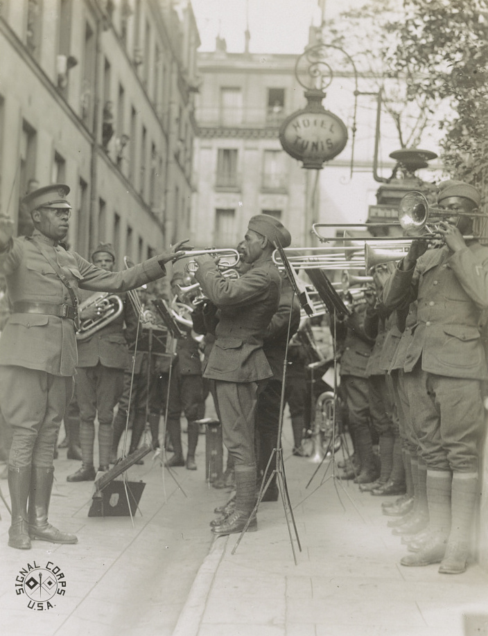 James Reese Europe conducting the 369th Regiment band in a Paris hospital courtyard, 1918