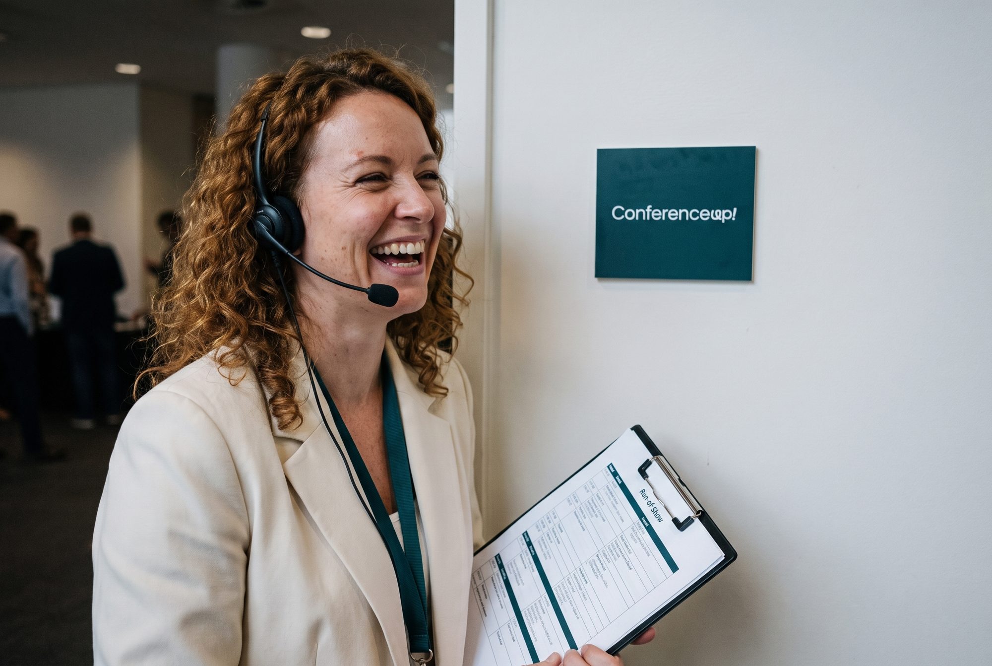 Event manager with a ConferenceUp! lanyard coordinating on-site