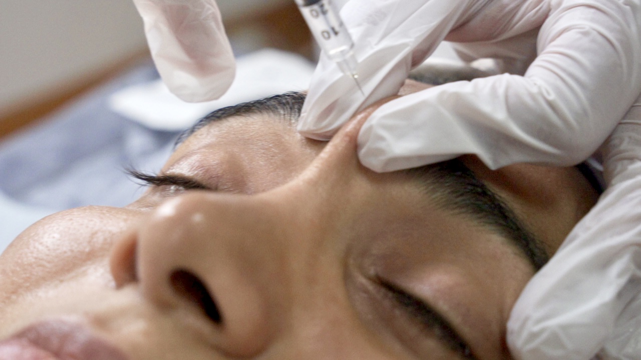 Close-up of a Botox injection procedure