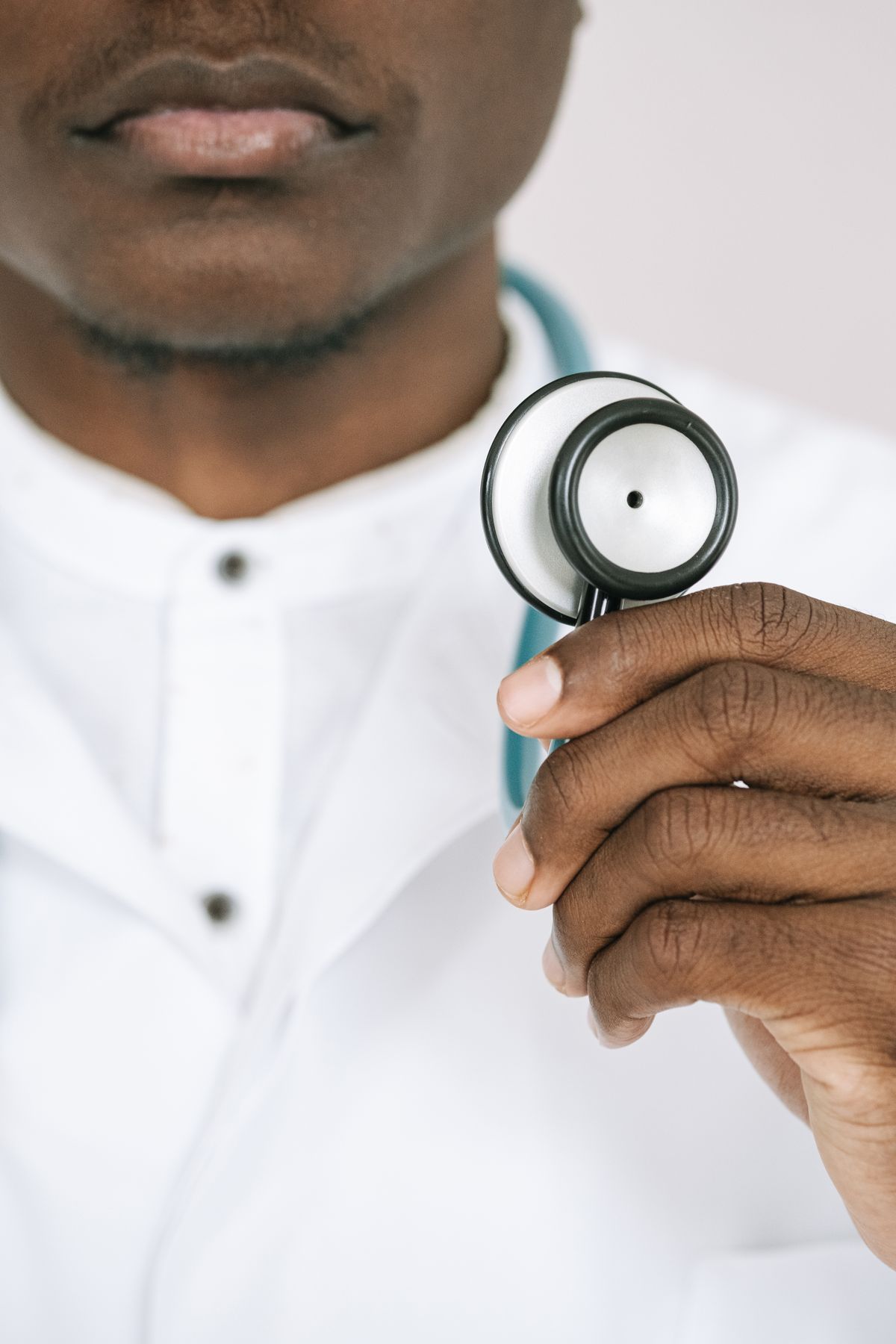 Doctor holding a stethoscope, ready for a patient exam