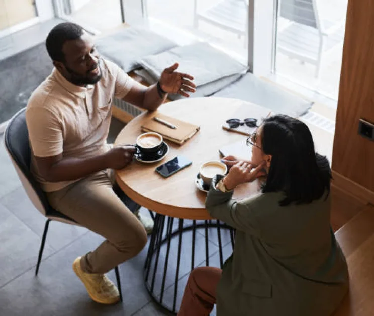 Adults making new friends over coffee