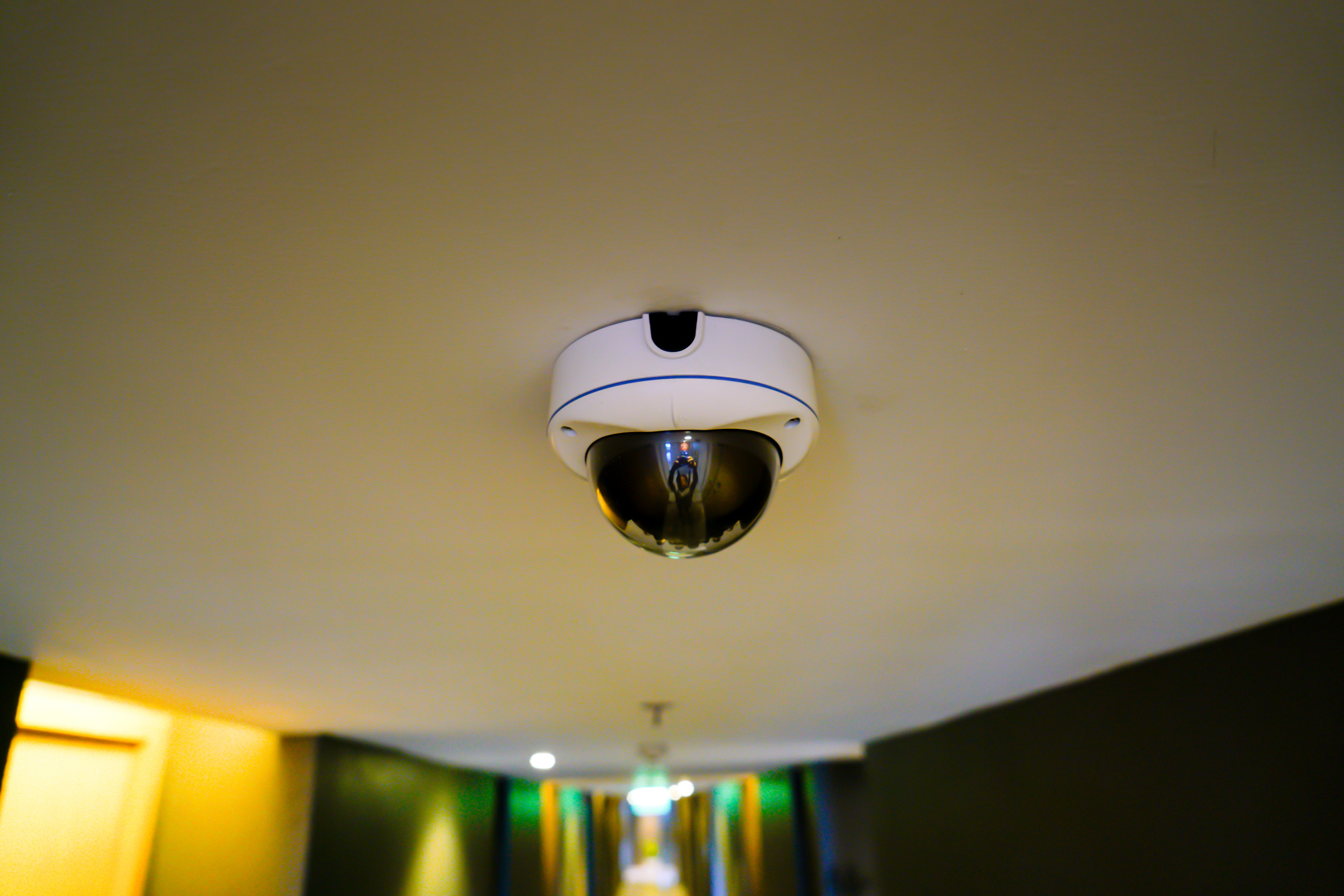 A security camera mounted in a school hallway