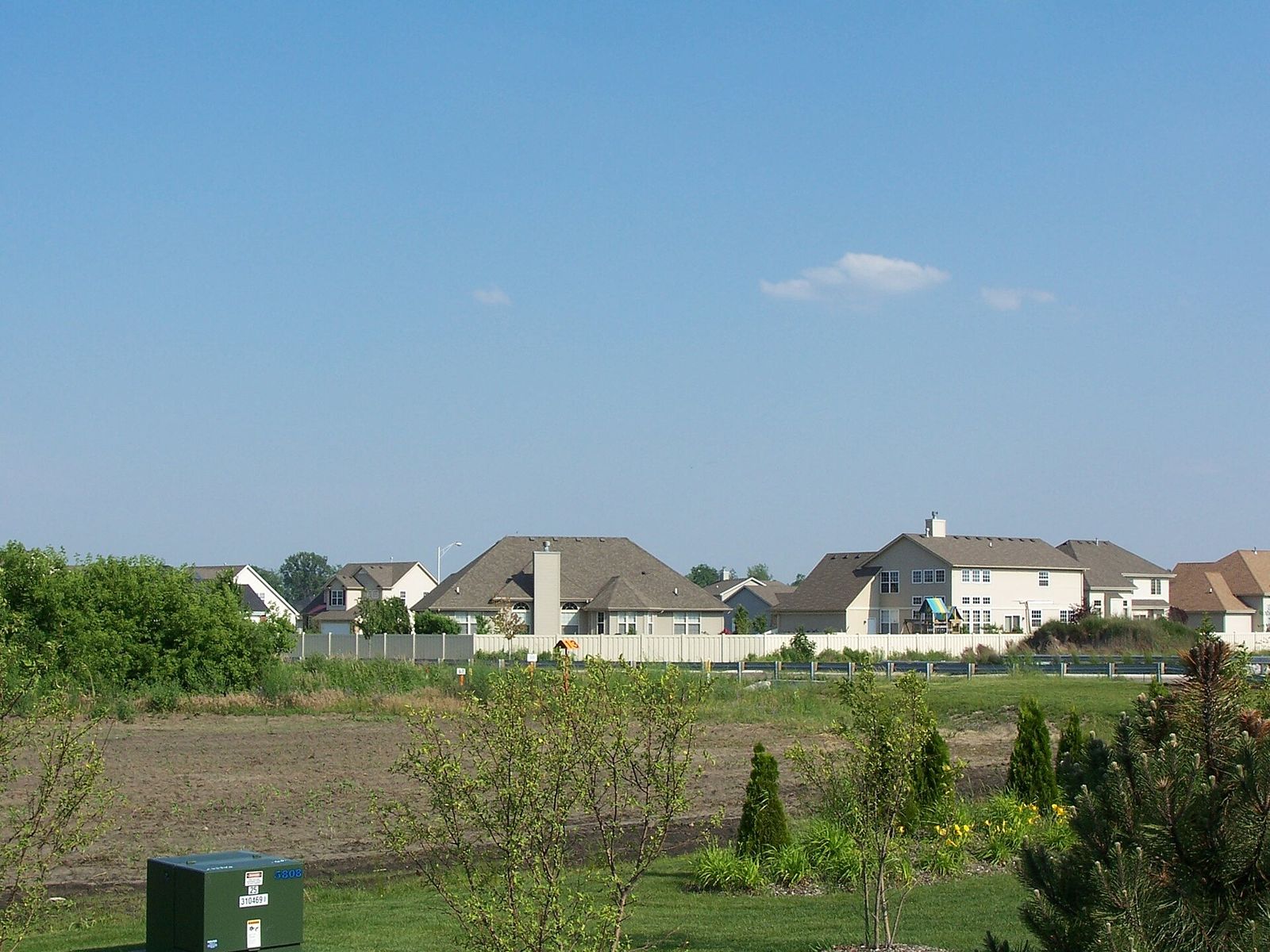 Suburban homes beyond open green space in Dyer, Indiana