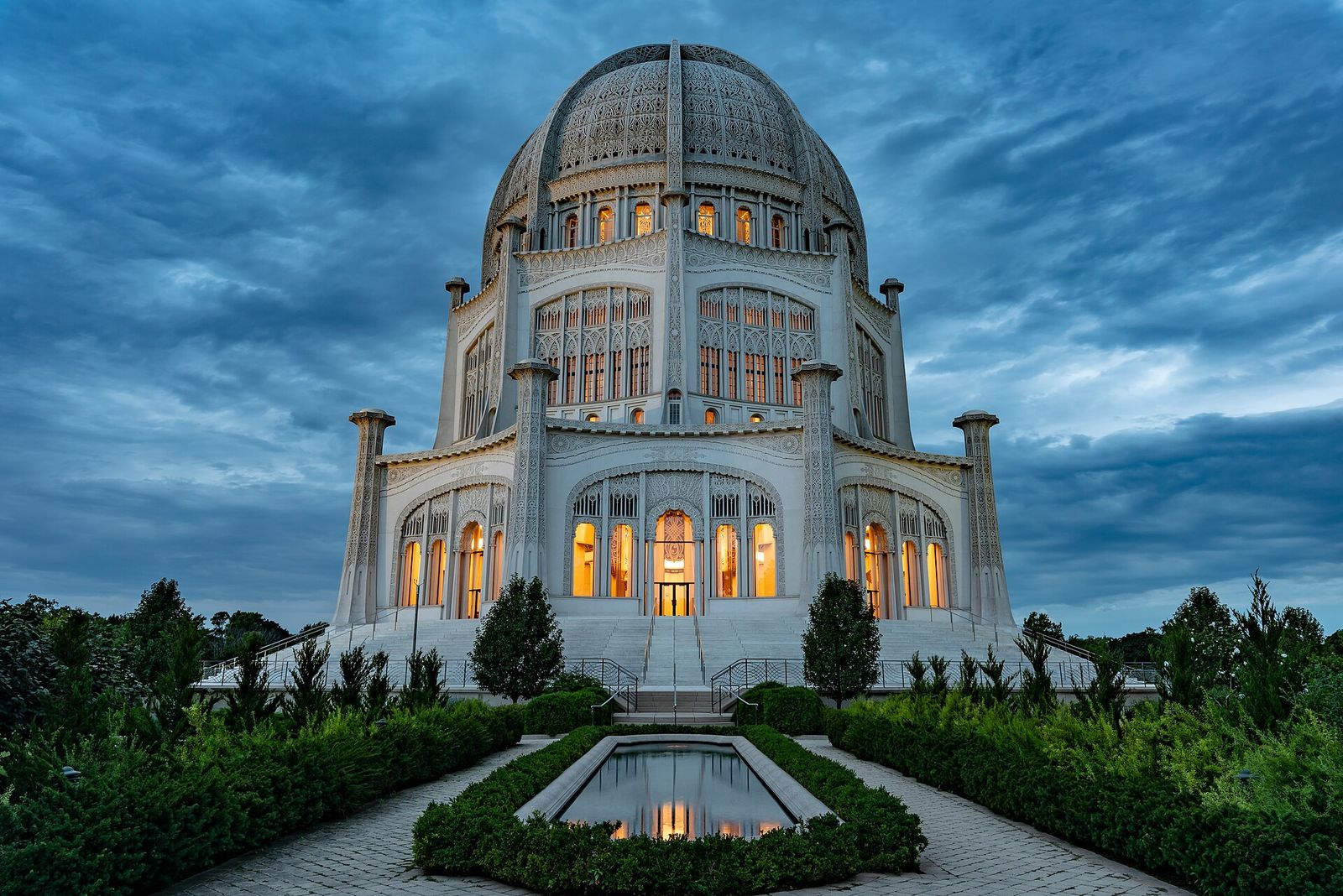 The Bahá'í House of Worship lit at dusk in Wilmette, Illinois