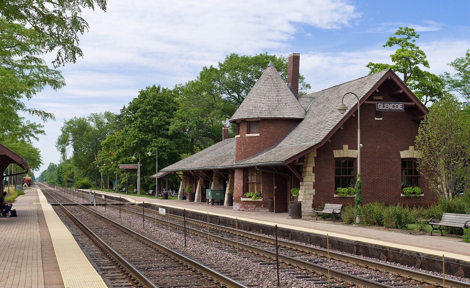 Historic brick Glencoe Metra station along the tracks in Glencoe, Illinois