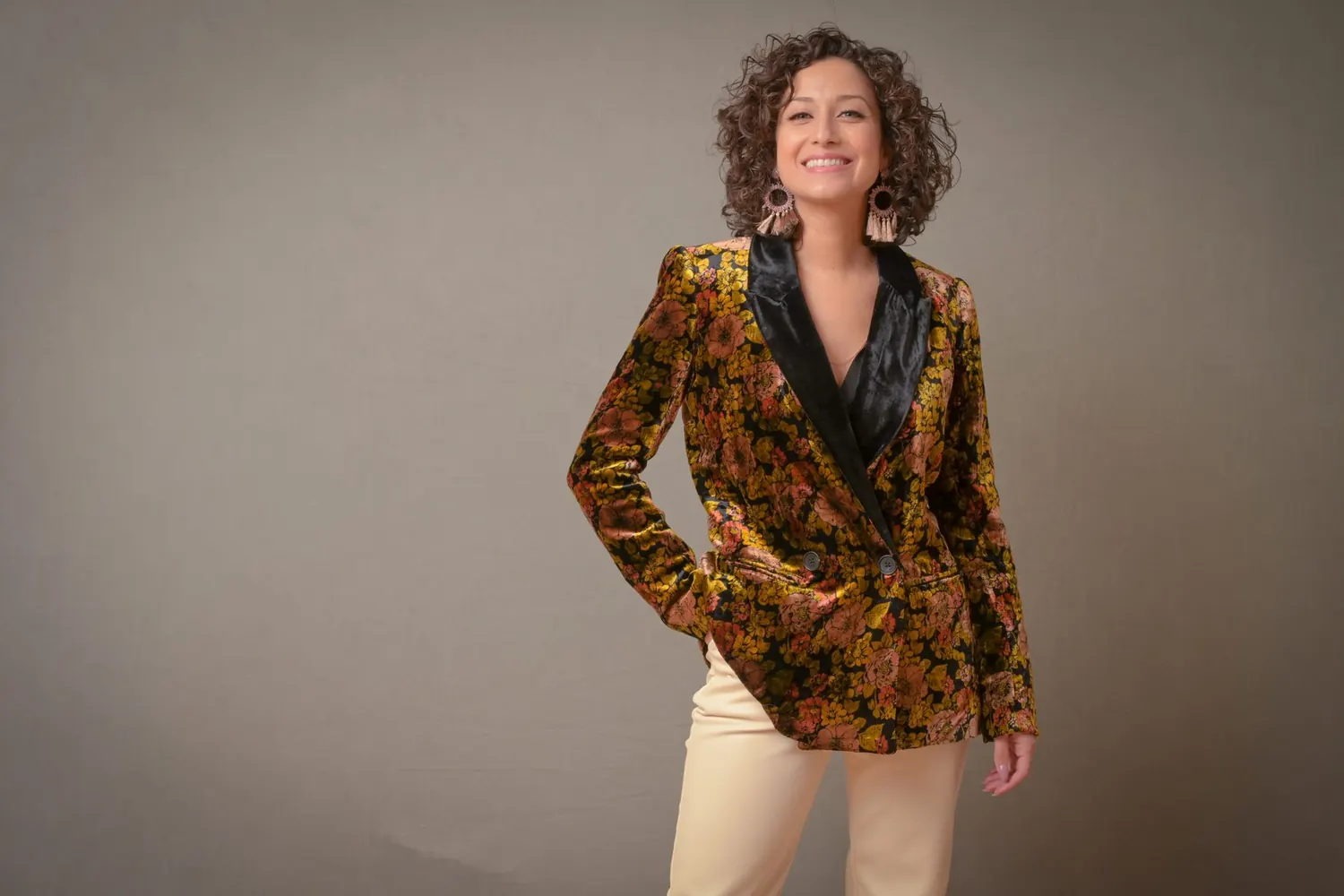 Micaela Vargas Cabrera smiling in a velvet floral blazer