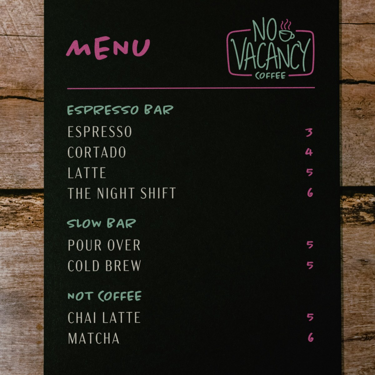 No Vacancy menu board in a rustic wooden frame