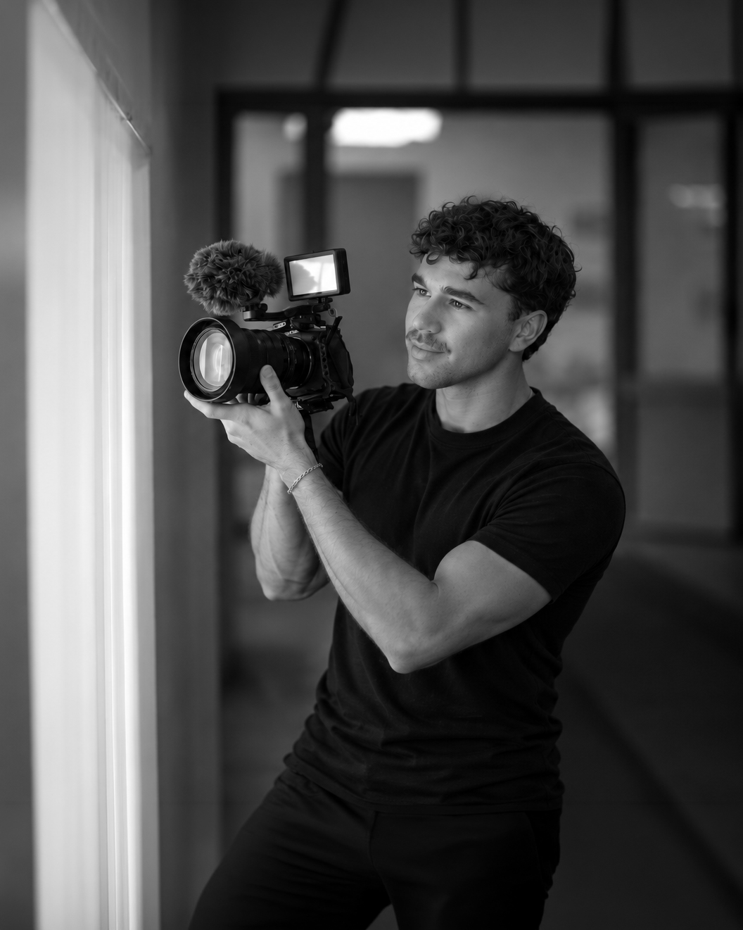 Filmmaker in a cinematic hallway