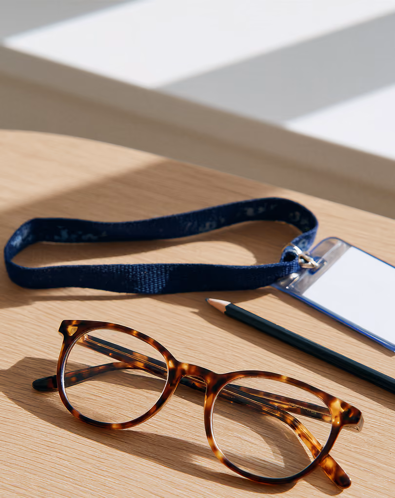 Glasses and notes on a desk