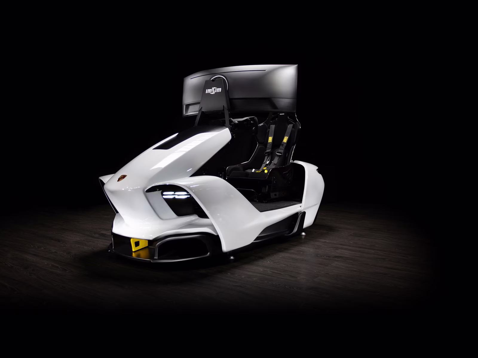 The ImSim Porsche Raceborn in white, lit in a dark studio.