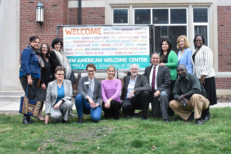 The launch of the New American Welcome Center, March 27, 2017, in front of its multilingual welcome banner at the University YMCA.