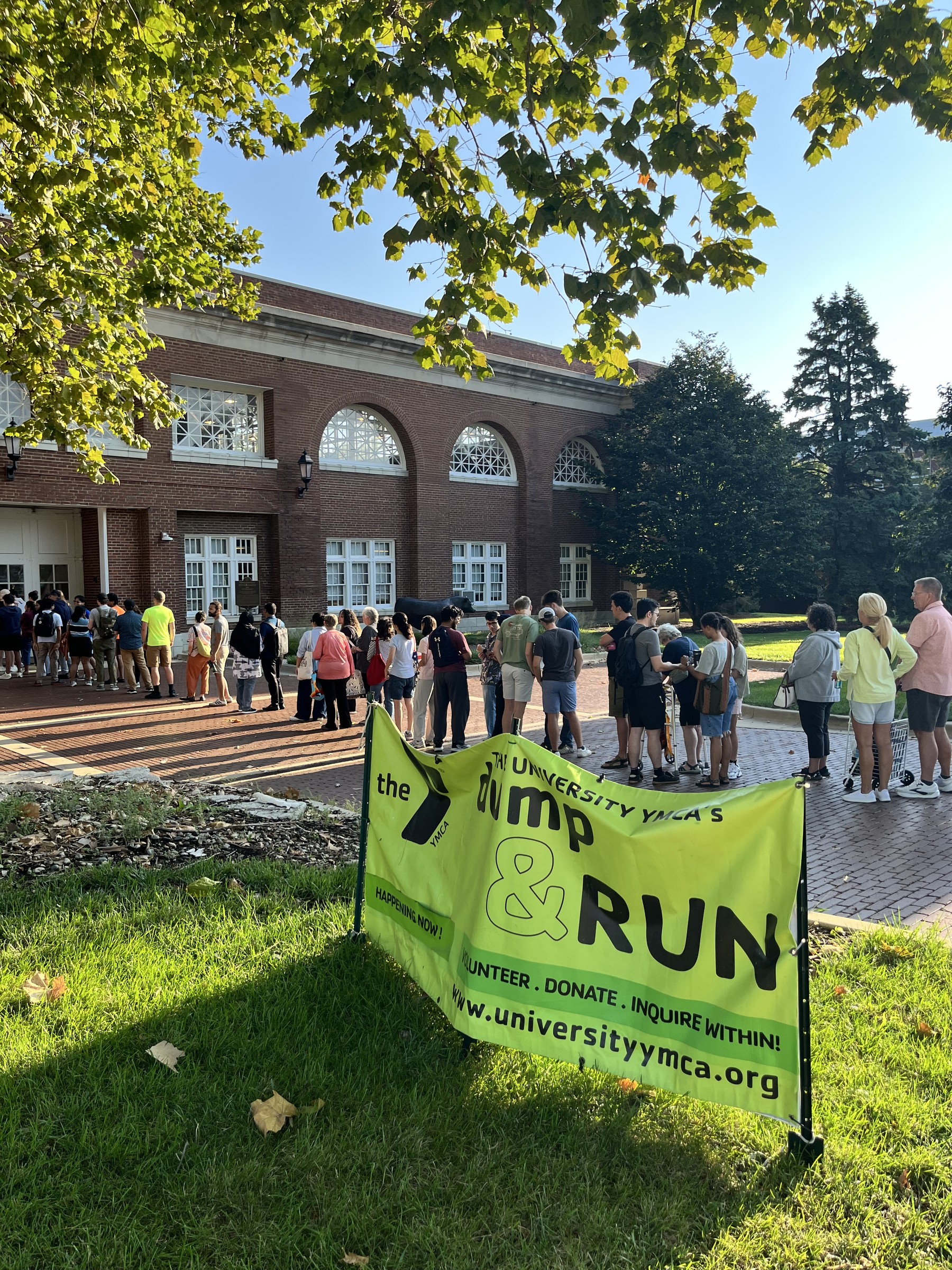 Shoppers line up outside the Stock Pavilion before the 24th Big Sale opens, Aug. 22, 2026. University YMCA photograph.