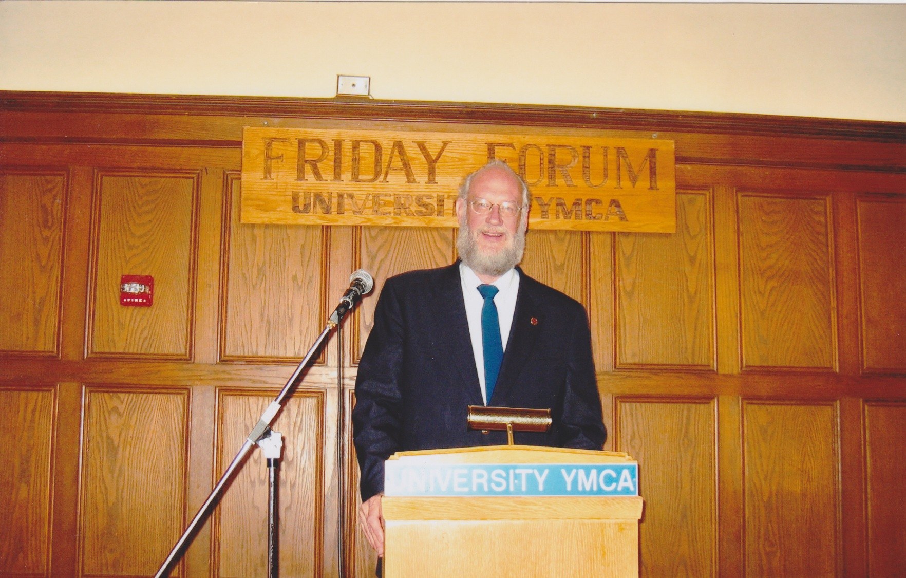 Steve Shoemaker at the Friday Forum lectern in Latzer Hall, 2004. University YMCA photograph.