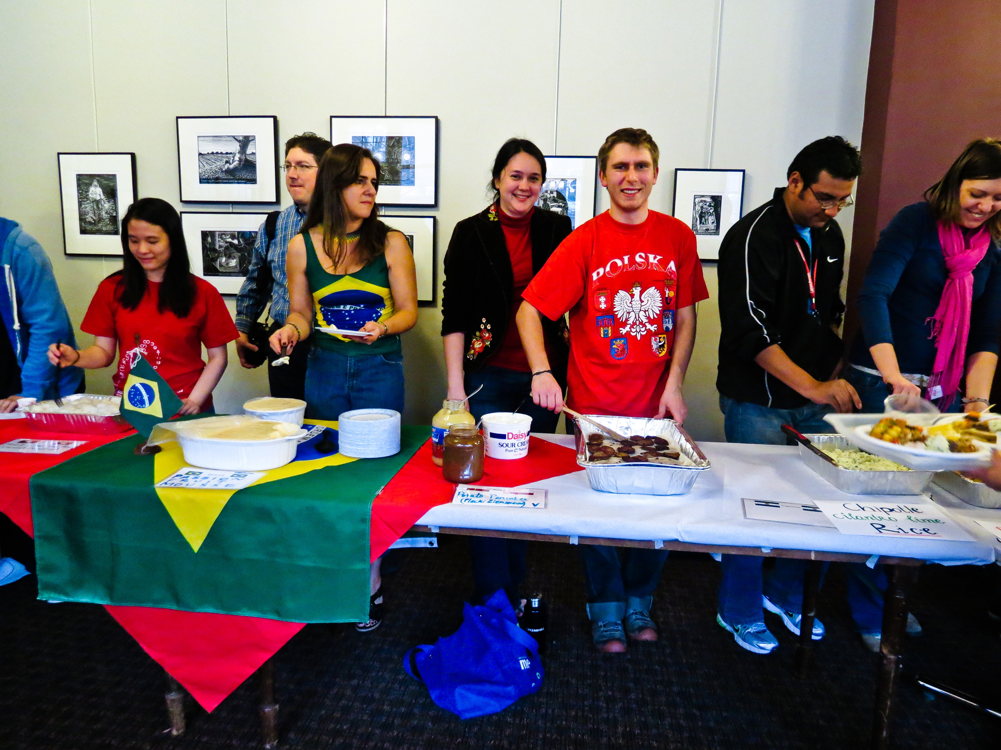 Volunteer cooks at a flag-draped table in Murphy Gallery at the 29th International Dinner, March 11, 2012.
