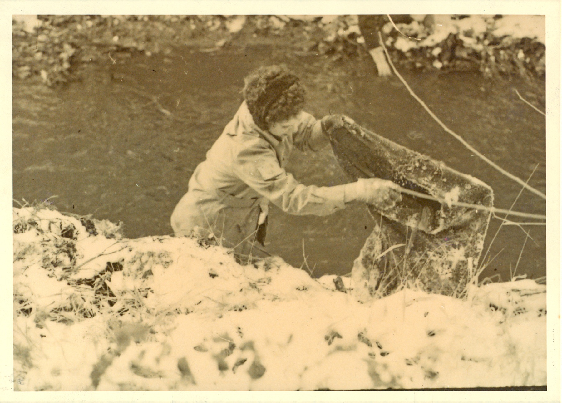 A volunteer hauls junk out of Boneyard Creek, probably during the cleanup of Nov. 21, 1969.