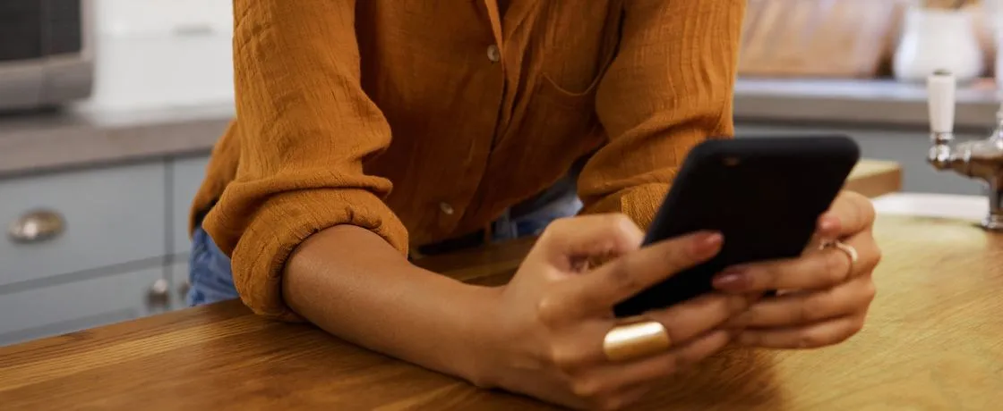 Close-up of hands holding a smartphone