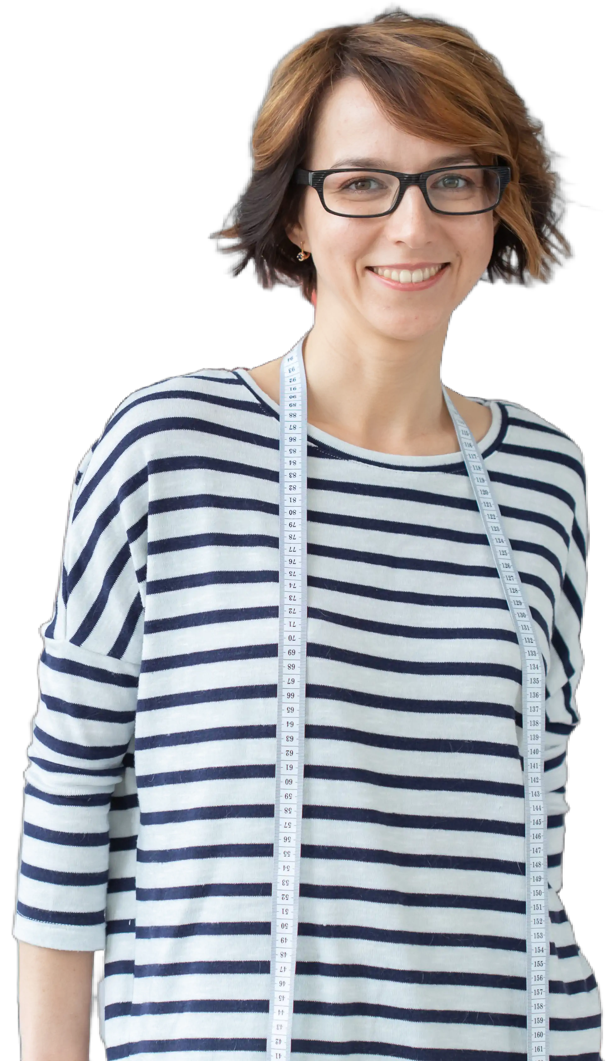 Smiling woman with short brown hair and glasses wearing a striped shirt and a measuring tape around her neck.