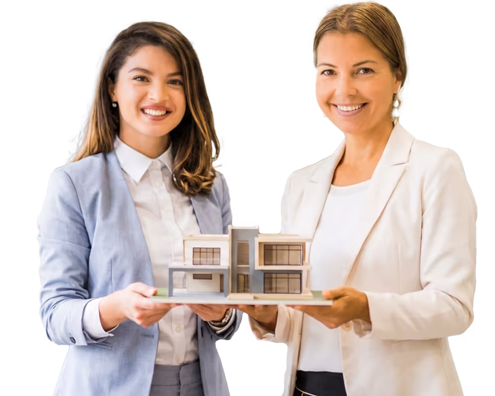 Two professional women smiling and holding a scale model of a modern two-story house.