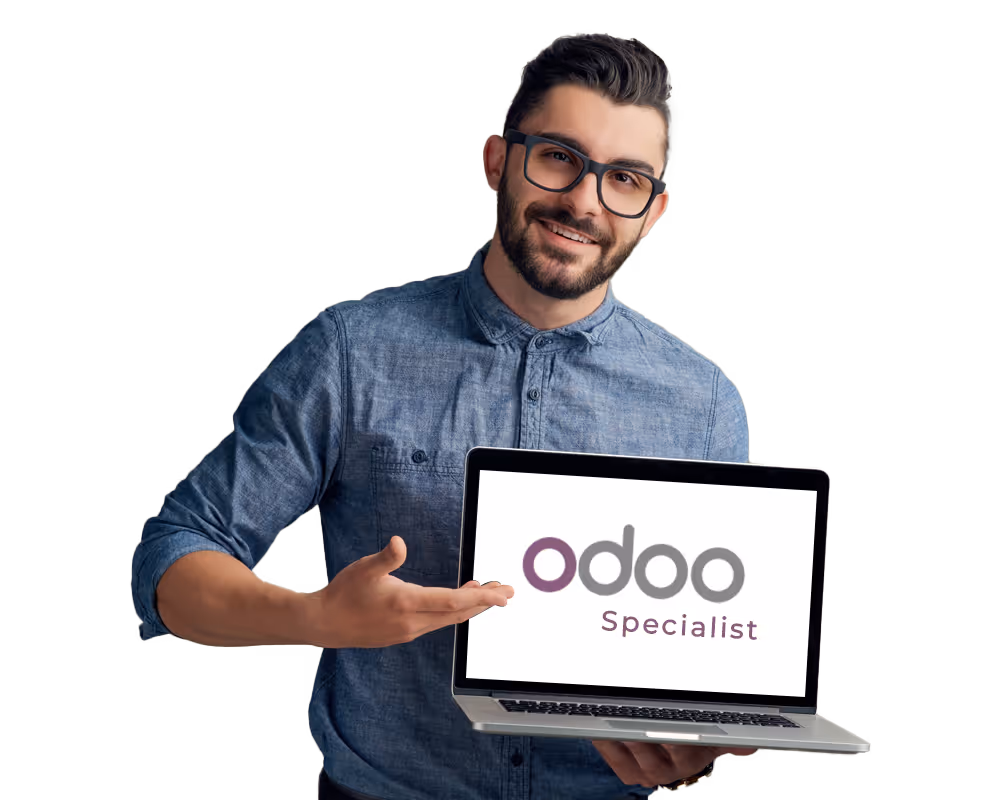 Man wearing glasses and a blue shirt holding a laptop showing the text 'odoo Specialist'.
