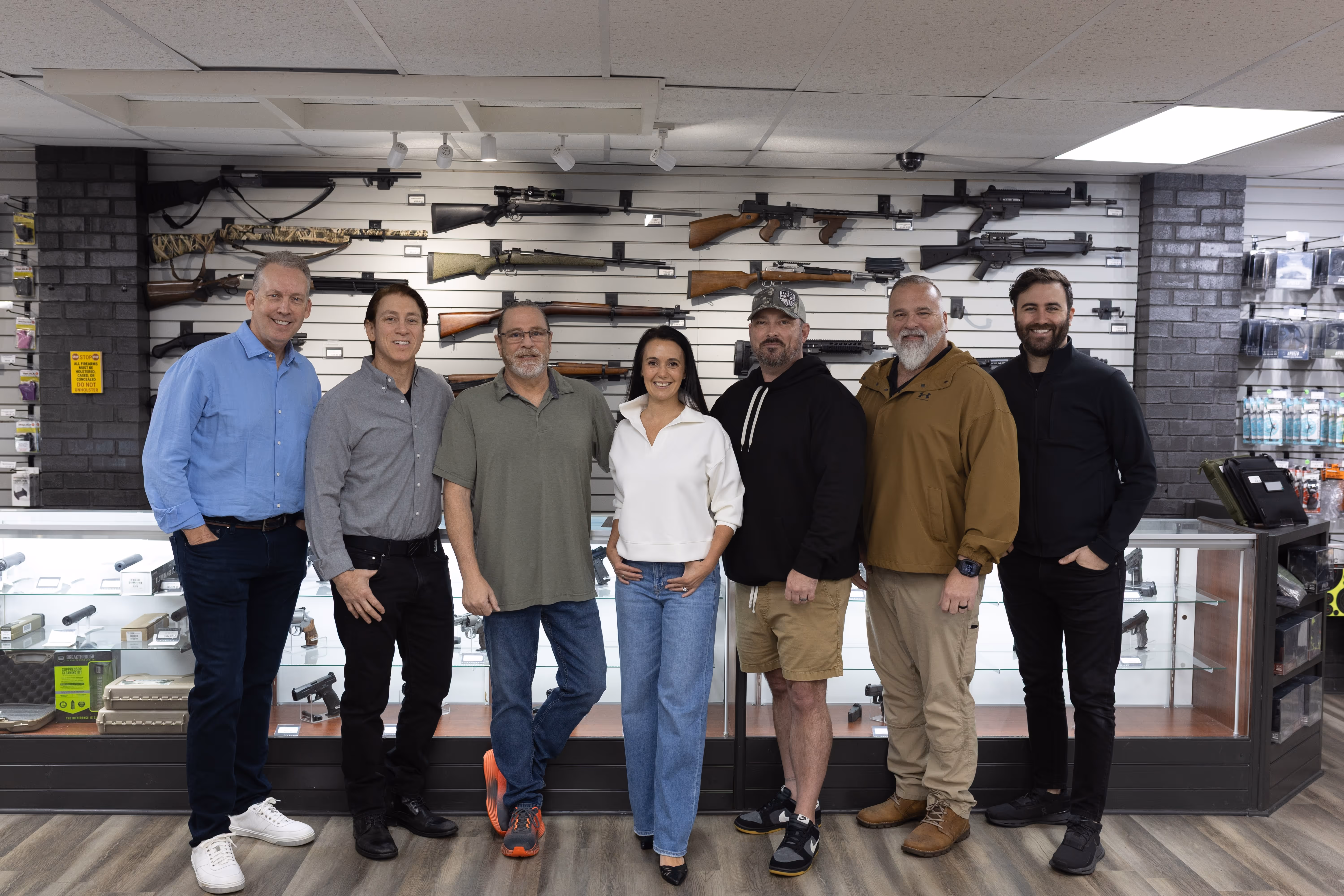 The Slingit team at a firearm dealer